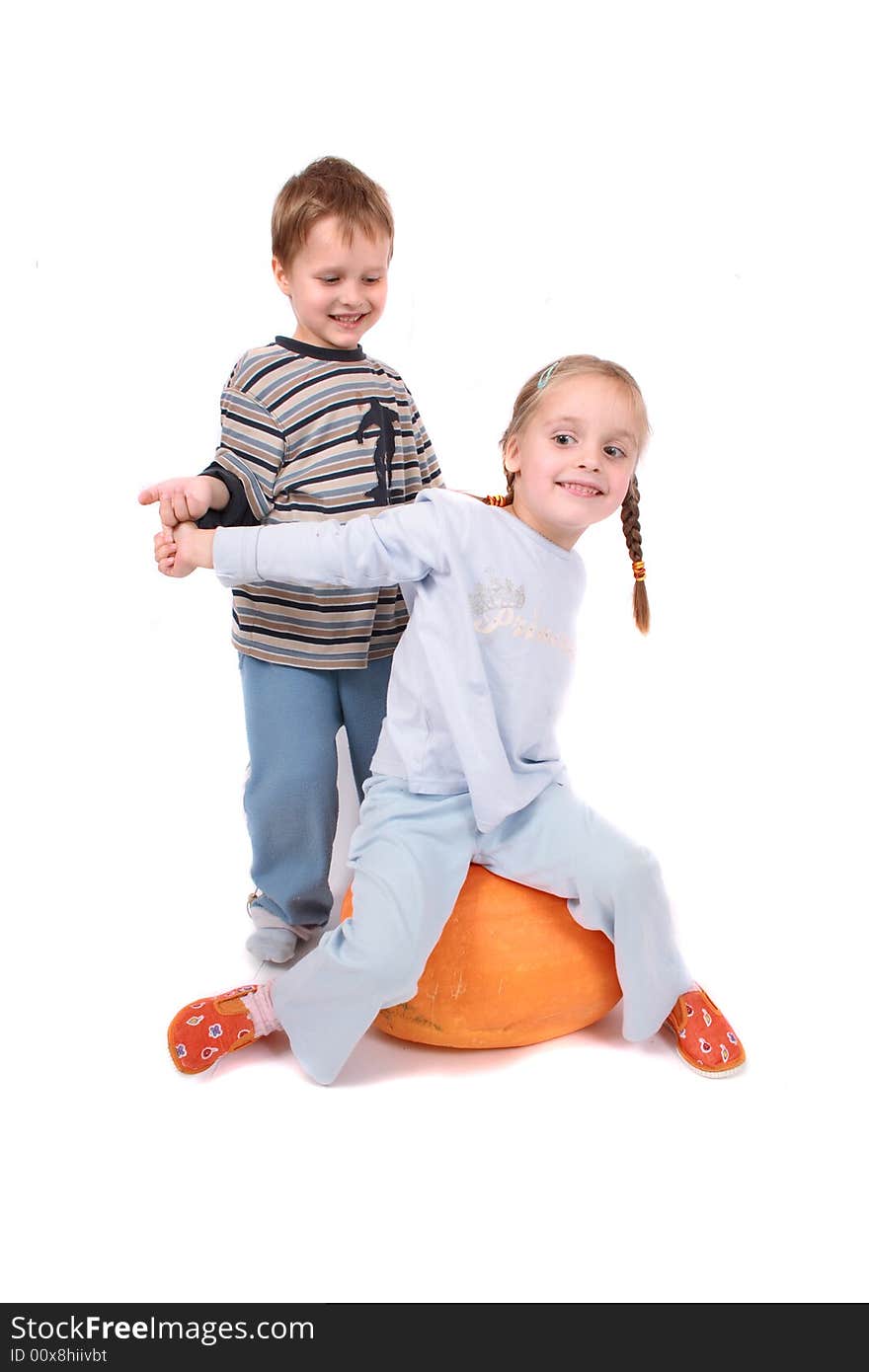 Twins and pumpkin on the white background