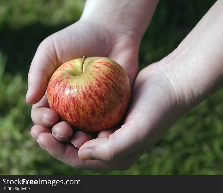 Holding an apple