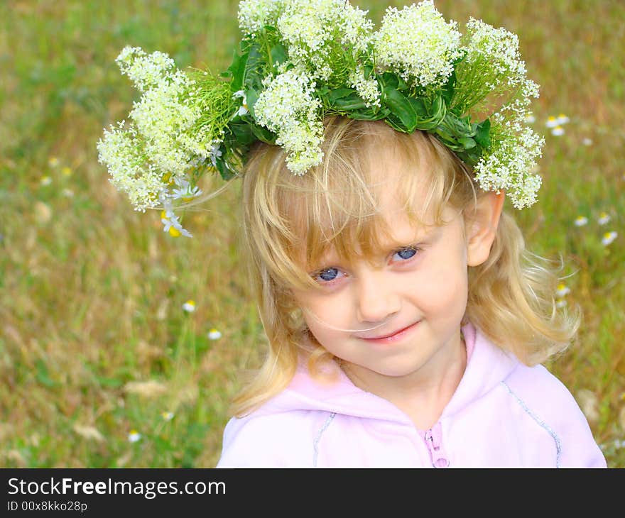 Nice little girl with a chaplet on the head. Nice little girl with a chaplet on the head.