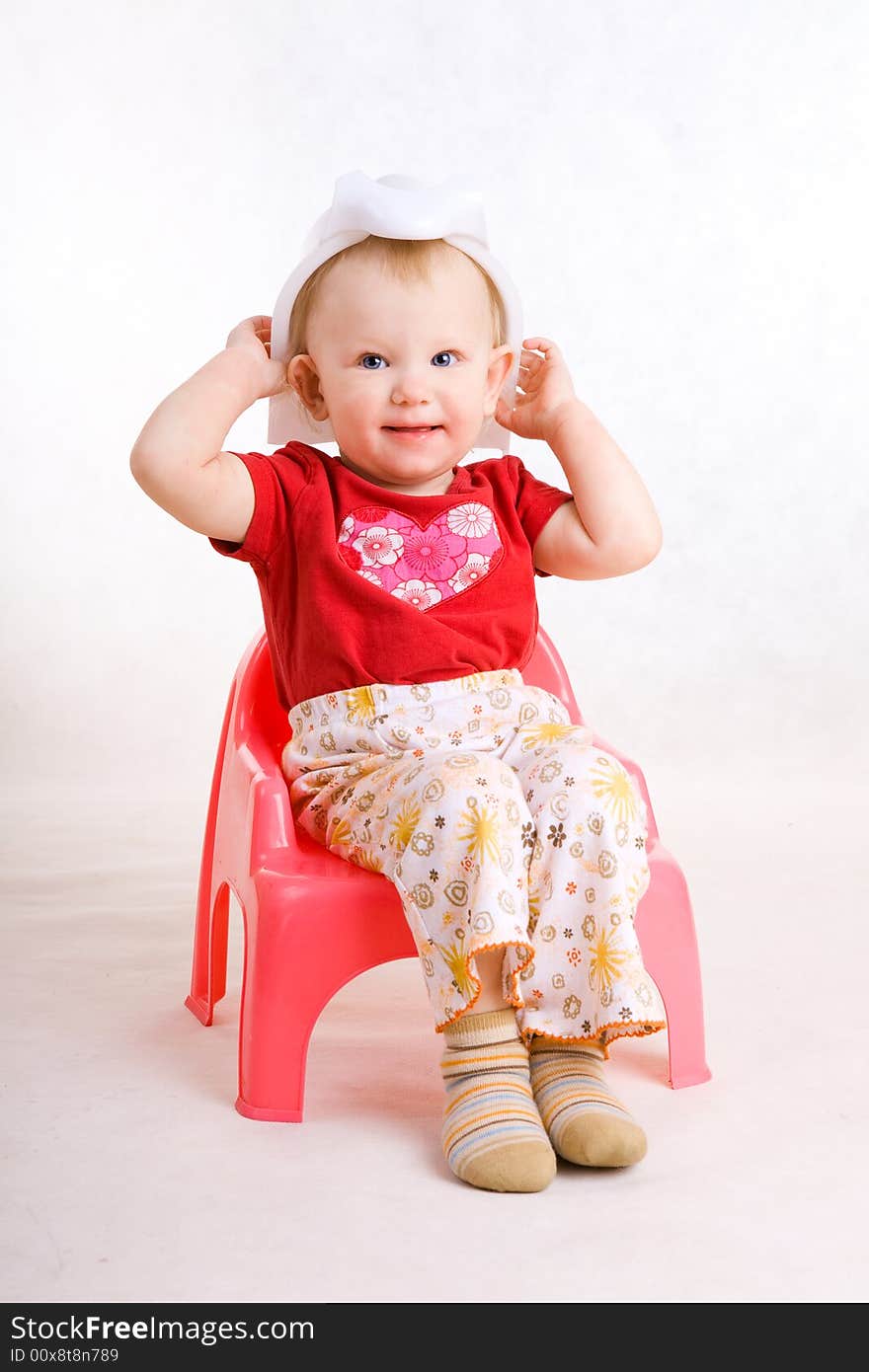 Smiling girl on the chamber-pot. Smiling girl on the chamber-pot