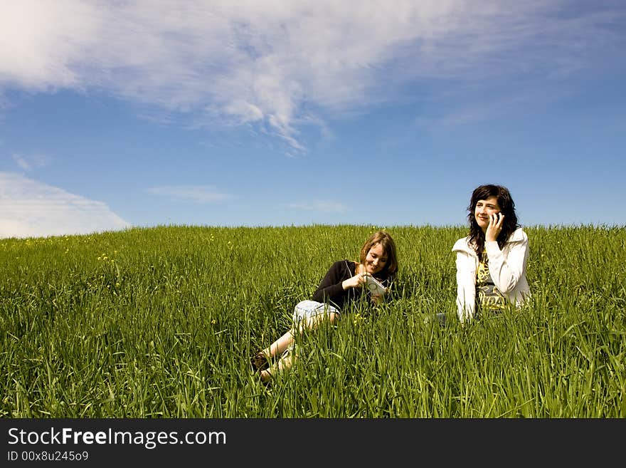 Couple Of Friends In Meadow