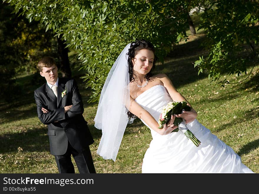 A bride and a groom outdoors. A bride and a groom outdoors