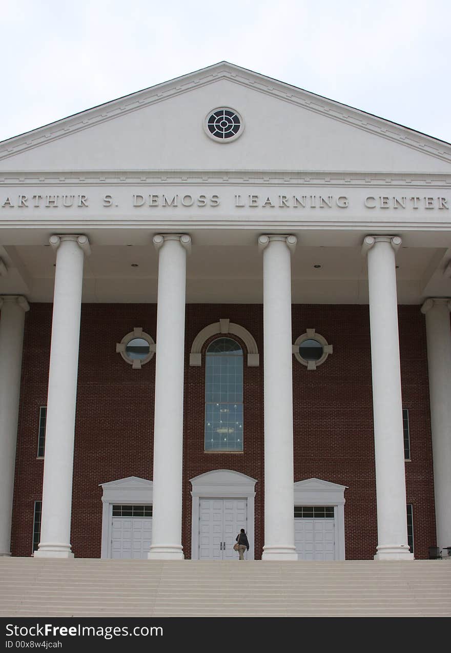 A Student entering a college learning center. A Student entering a college learning center.