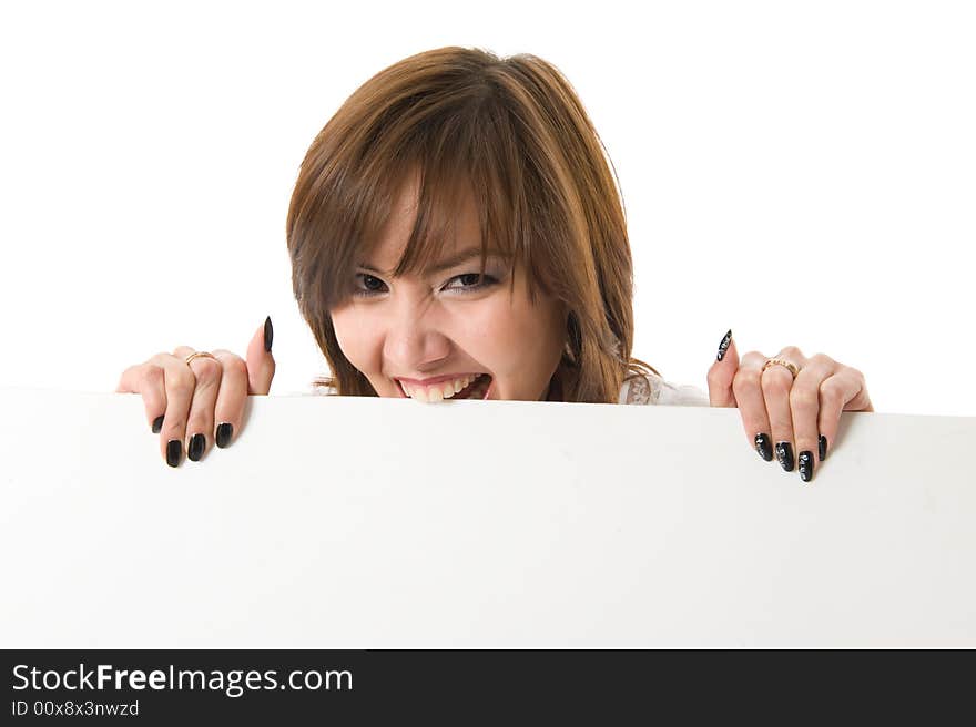 Close-up. Beautiful woman holding a billboard and Bites a board. Isolated on white