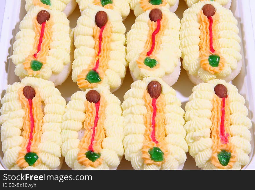 delicious indian sweets in a yellow and white flower shape