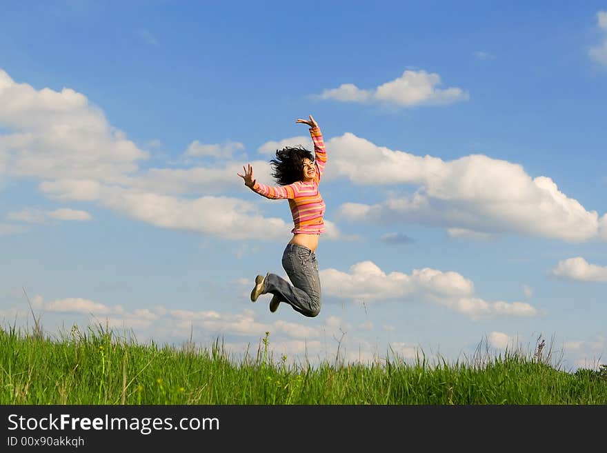 Happy young woman is jumping