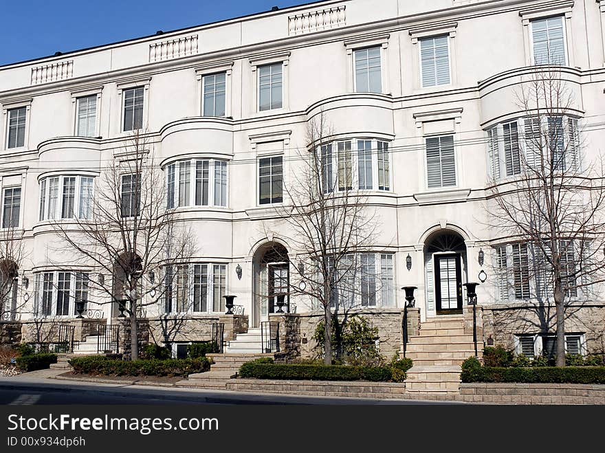 Nicely designed row of classically styled townhouses. Nicely designed row of classically styled townhouses.