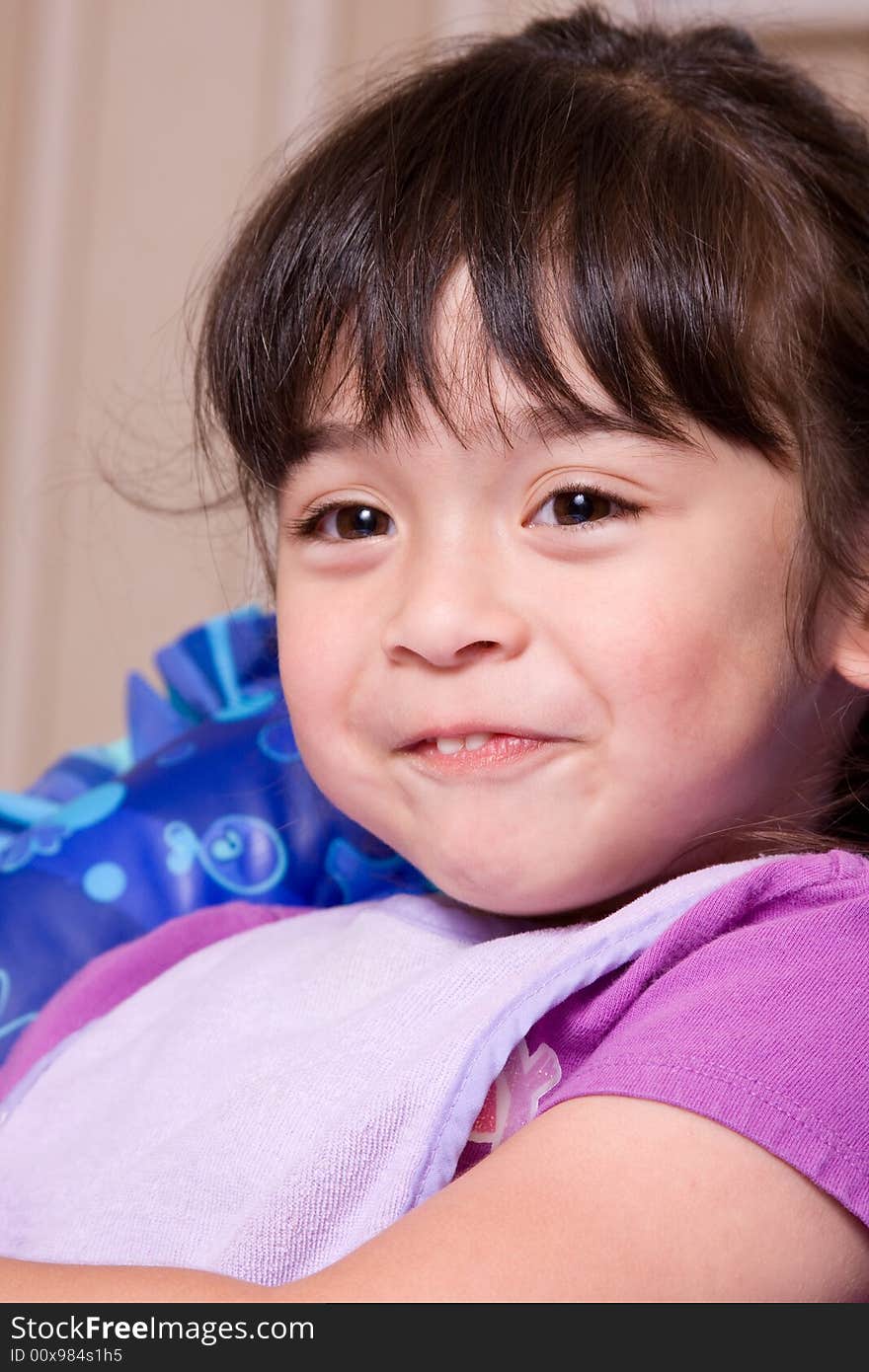 A cute and adorable little girl in smiling. A cute and adorable little girl in smiling.