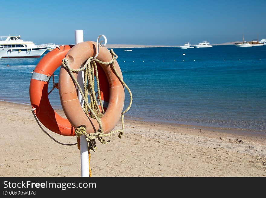 Life preservers on a beach near the sea. Life preservers on a beach near the sea