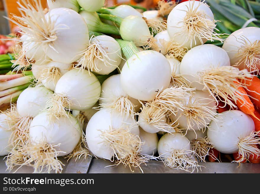 Spicy fresh spring onions at the vegetable market