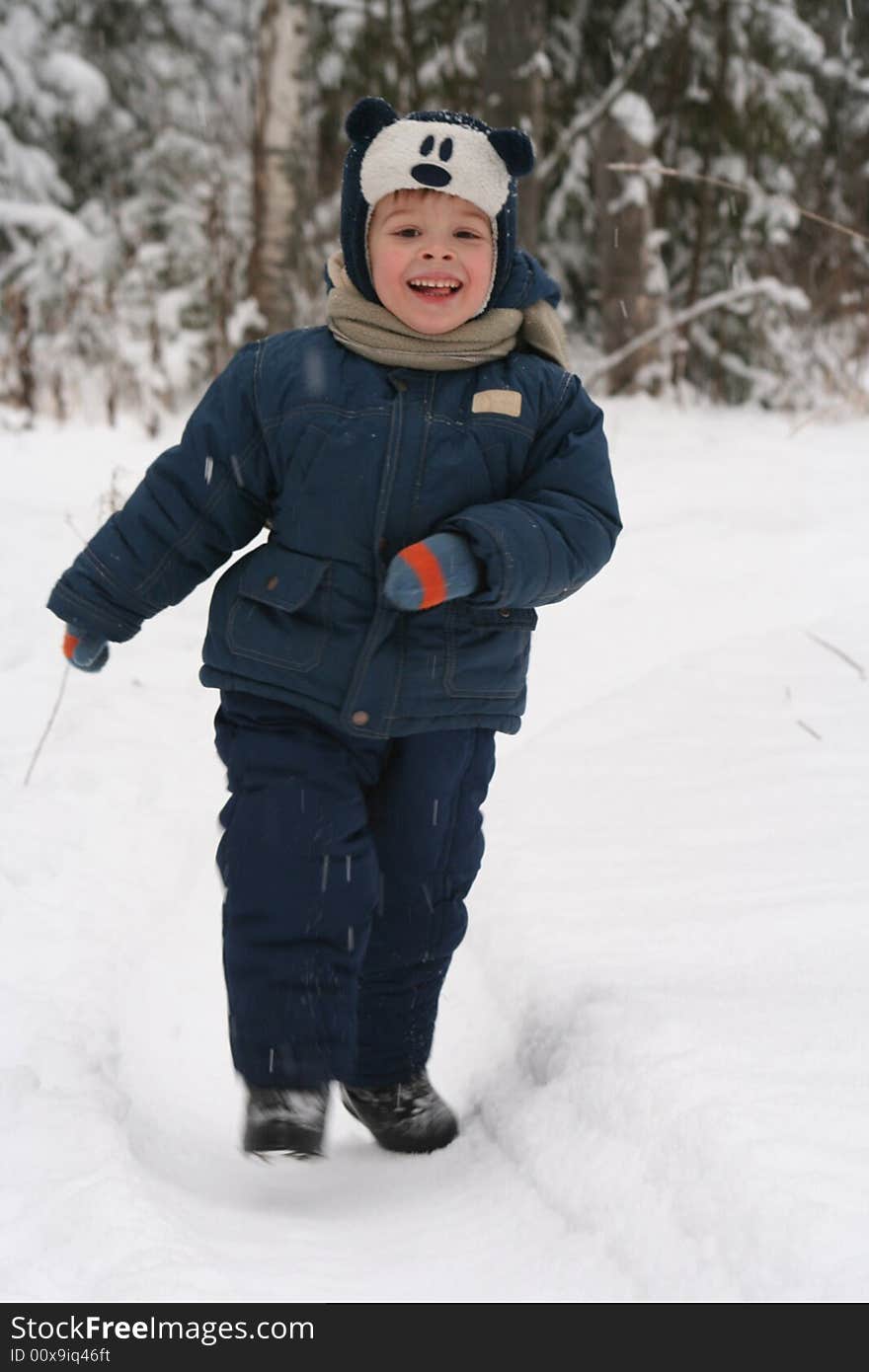 The happy child goes on a wood