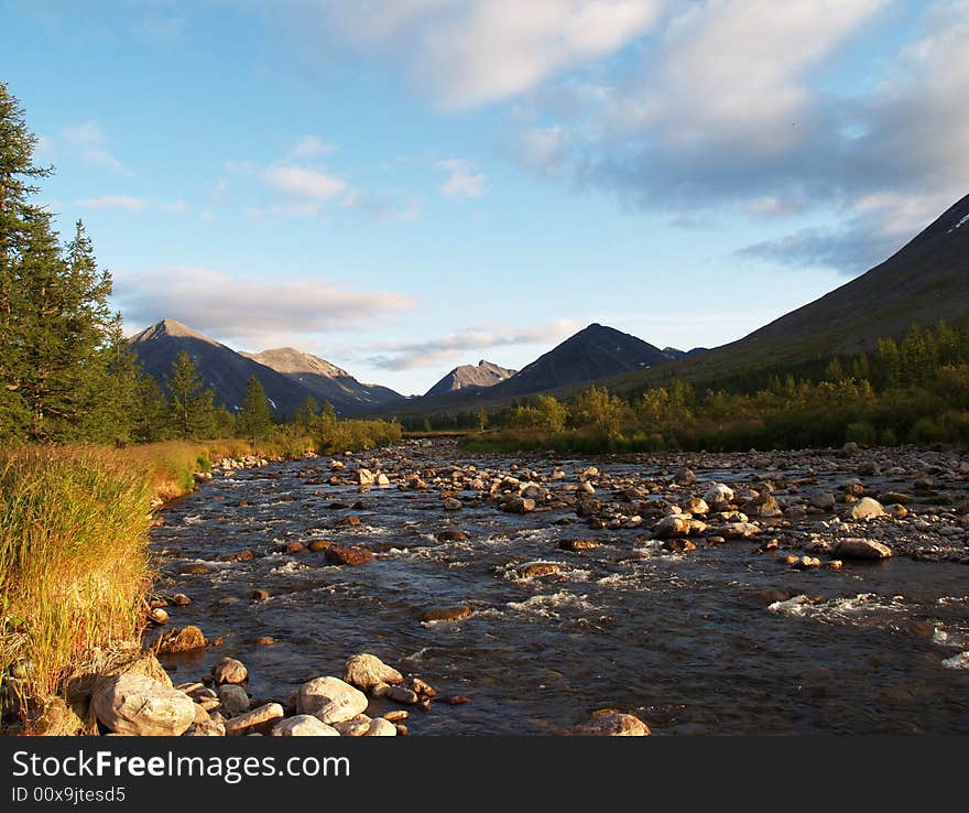 Photo. Landscape: rapid river, mountains, sky and forest. Photo. Landscape: rapid river, mountains, sky and forest