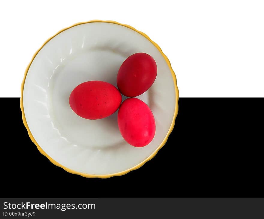 Three red easter eggs on a plate. Three red easter eggs on a plate