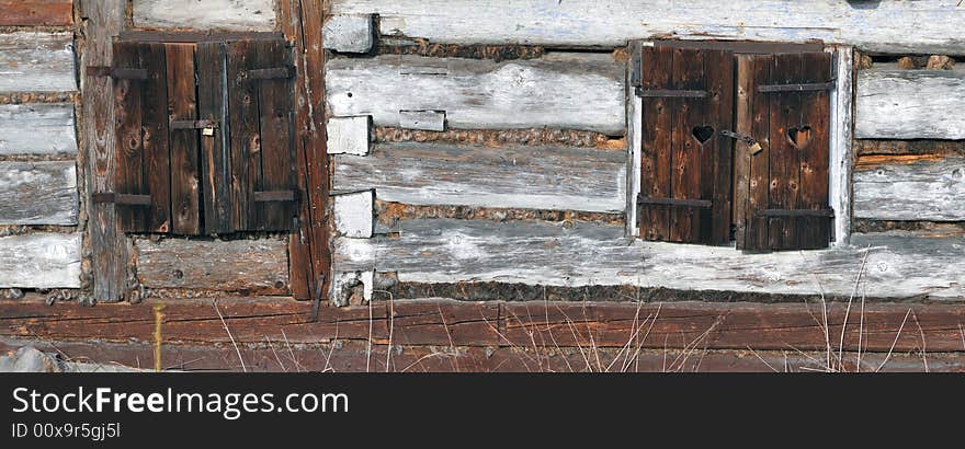 Closed windows with old rust padlock. Closed windows with old rust padlock