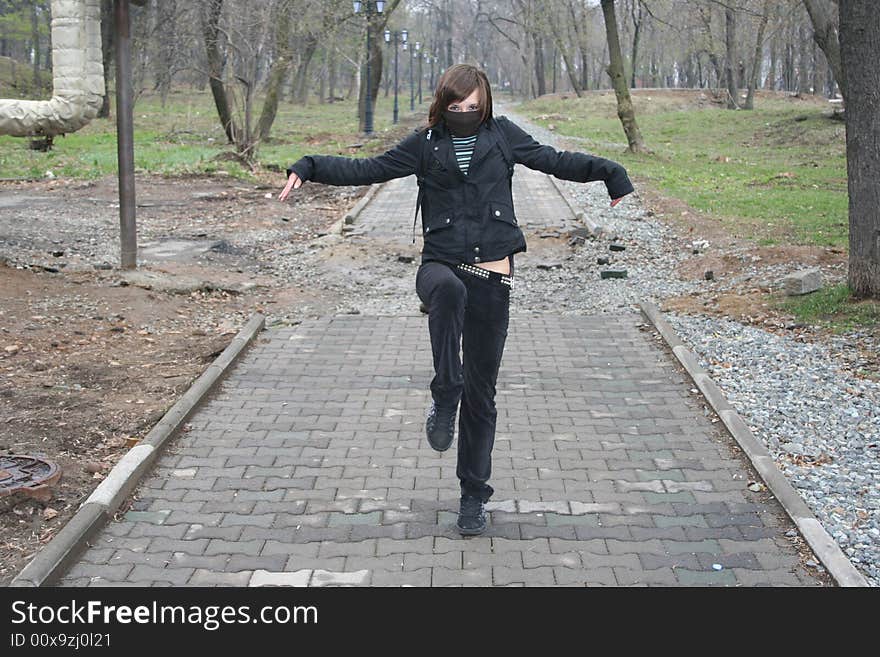 The girl in park is posed to the Asasin (Ninja). The girl in park is posed to the Asasin (Ninja).