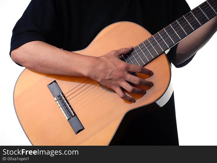 Shot of a male hand strumming guitar strings. Shot of a male hand strumming guitar strings