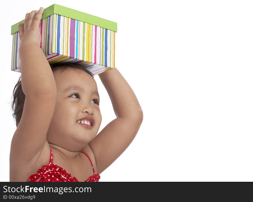 Cheerful child holding a green stripes box