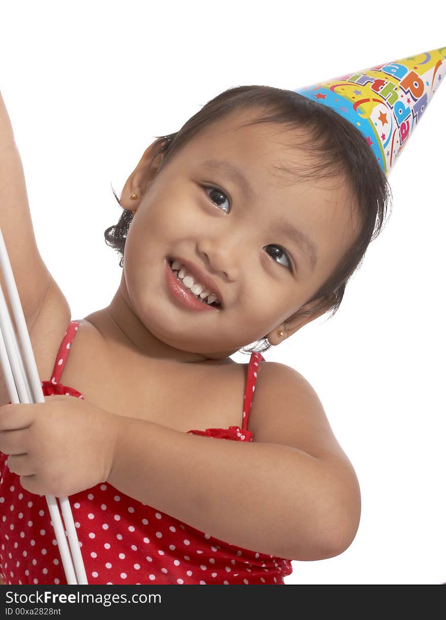 Girl with party hat on red top