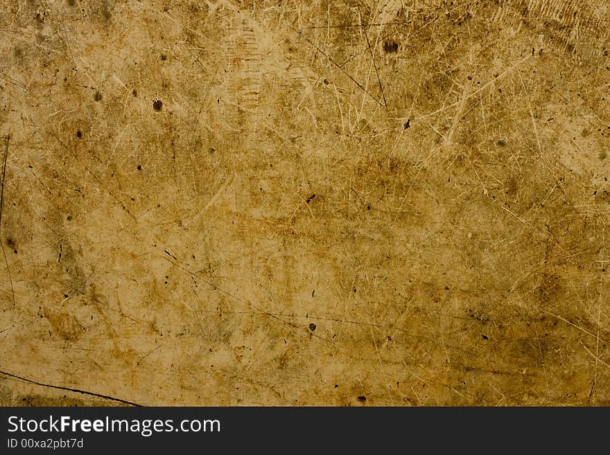 A background of brown and tan particle board fibers. A background of brown and tan particle board fibers.