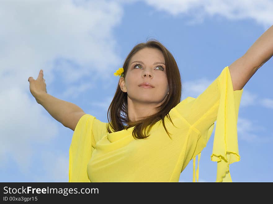 Portrait Of A Smiling Young Woman With Open Hand.