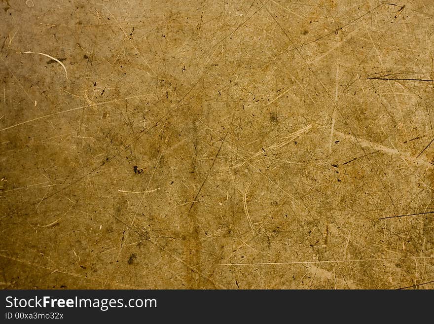 A background of brown and tan particle board fibers. A background of brown and tan particle board fibers.