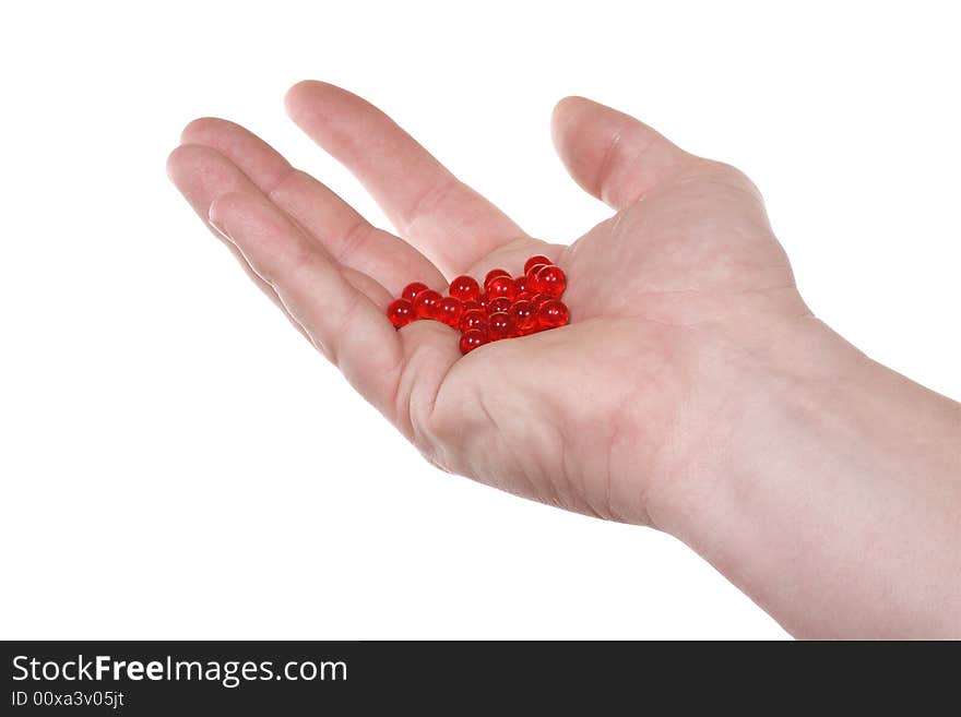 Hand with red pills.  Isolated on white [with clipping path]. Hand with red pills.  Isolated on white [with clipping path].