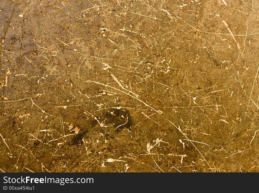 A background of brown and tan particle board fibers. A background of brown and tan particle board fibers.