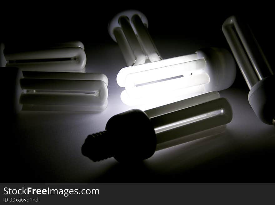 Efficient power saving fluorescent bulb on black. Efficient power saving fluorescent bulb on black