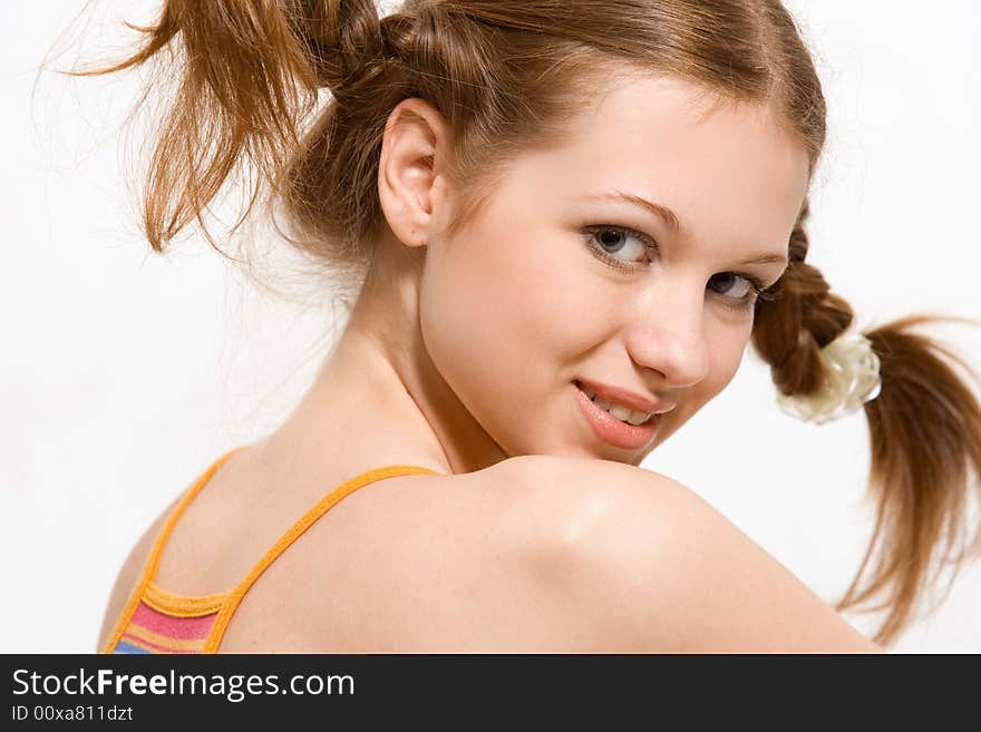 model with pigtails dressed rainbow-colored short dress