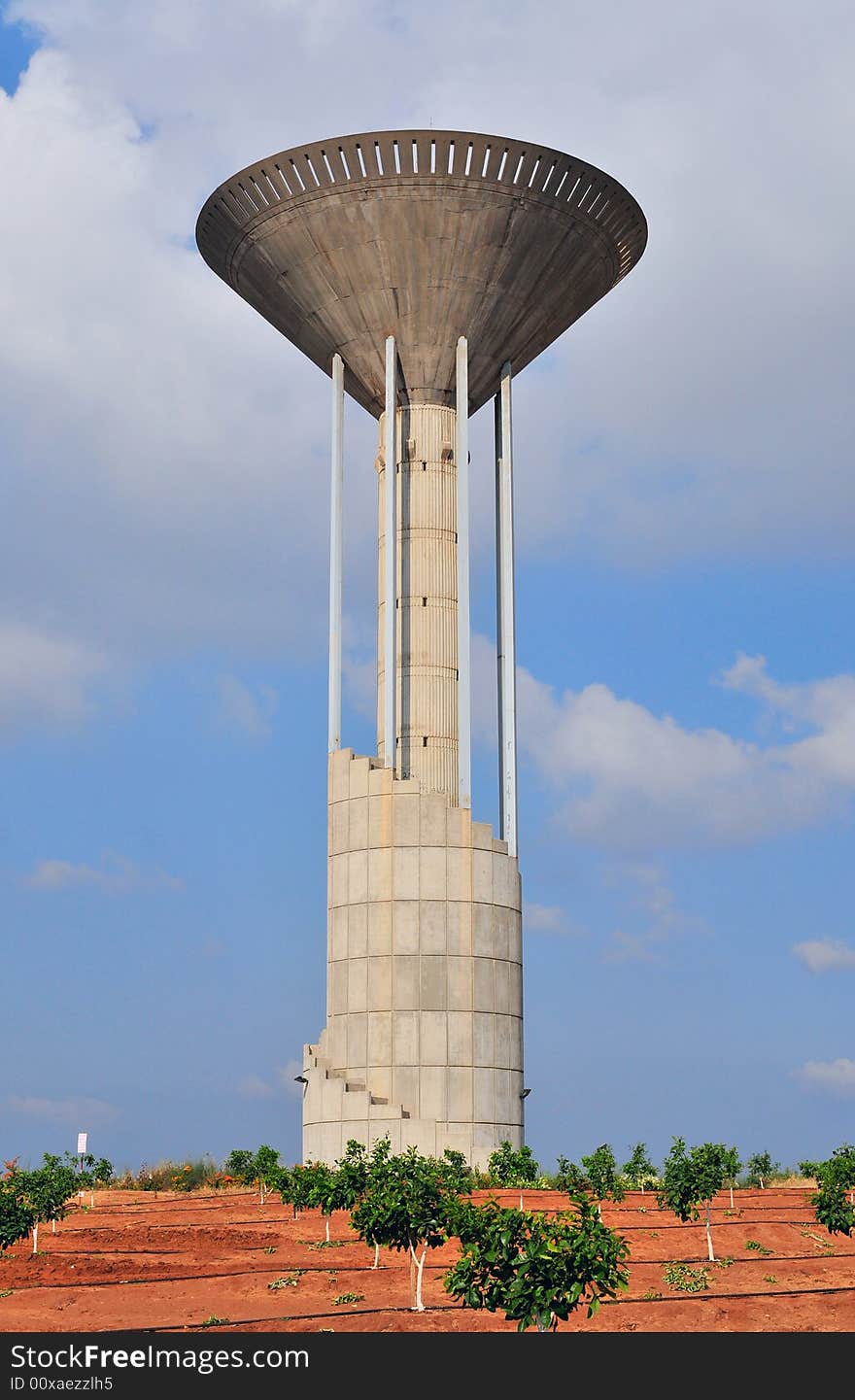 Water tower from concrete in form of the torchlight