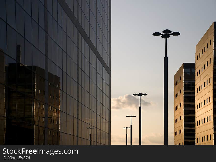 Skyscrapers and streetligts in the sunset