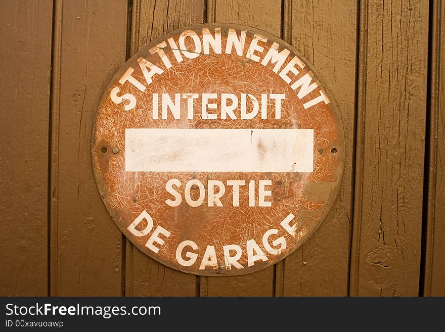 Forbidden sign at the door of a garage at the south of france)