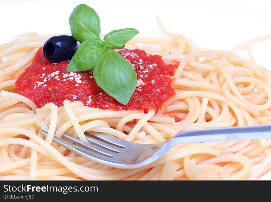 Pasta with tomato sauce basil and grated parmesan