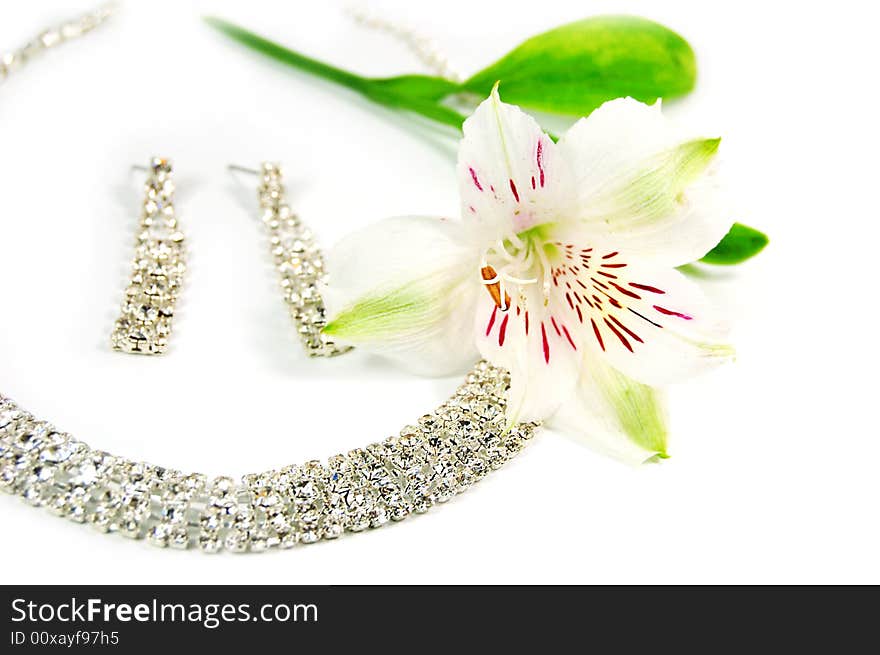 Wedding jewelery, laces, earrings and white flower. Wedding jewelery, laces, earrings and white flower