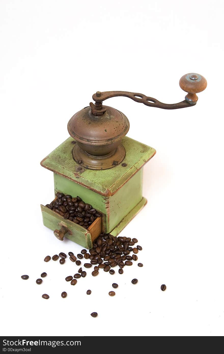 Old coffee grinder with coffee beans