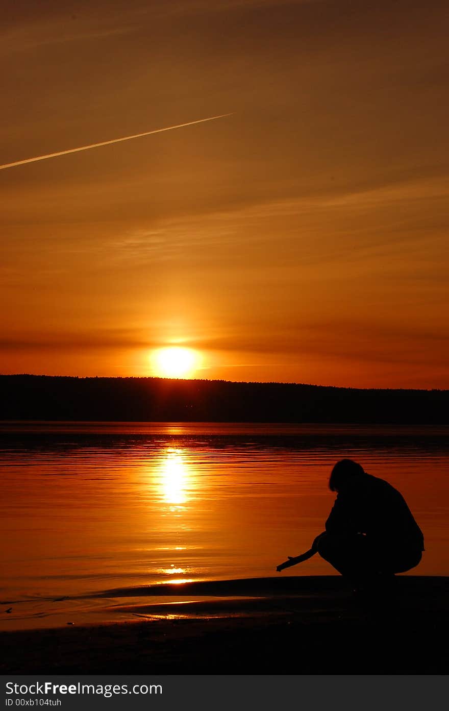 Man young - sunset on sea