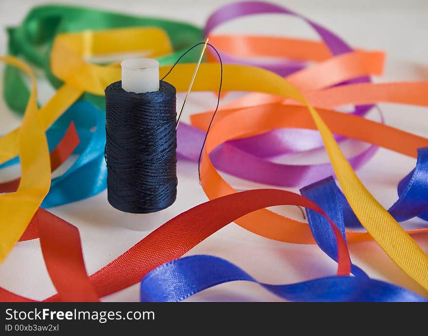 Needle and a thread closeup. Abstract picture.