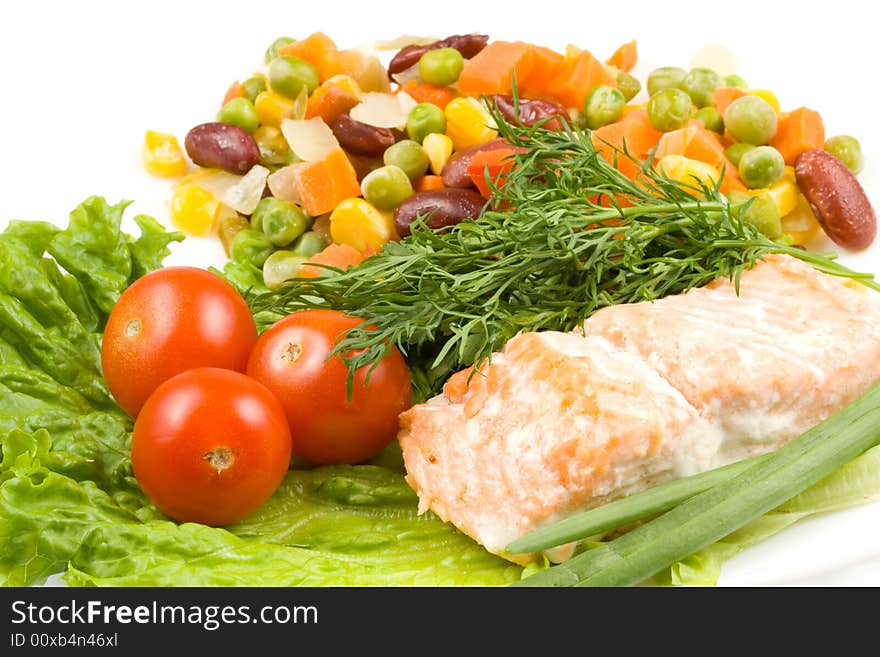 Stake from a salmon with vegetables on a plate