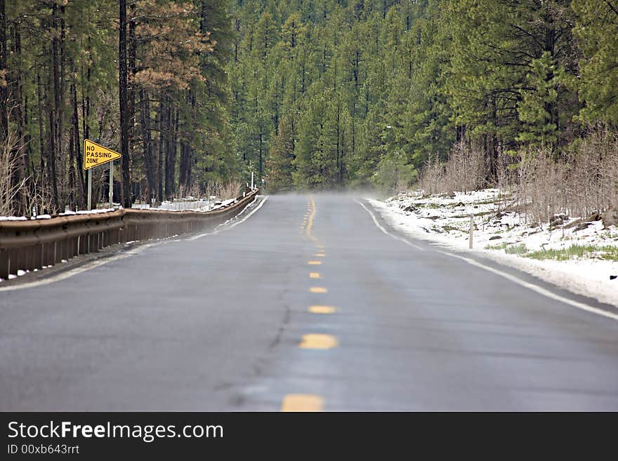 A late spring snowfall causes steam to rise from this Arizona highway. A late spring snowfall causes steam to rise from this Arizona highway