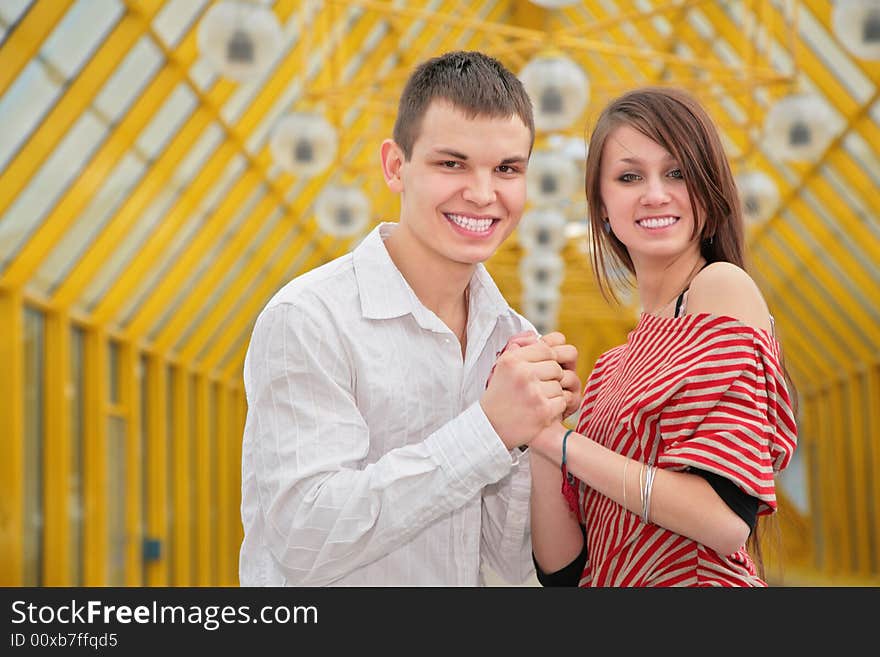 Young couple on yellow footbridge. Young couple on yellow footbridge