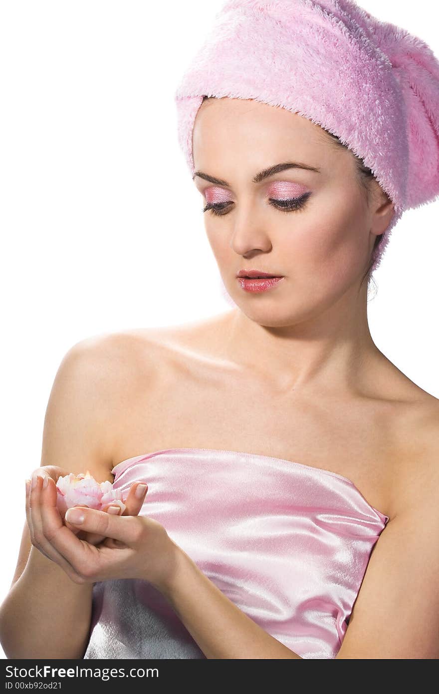 Beautiful woman wearing pink towel on her head