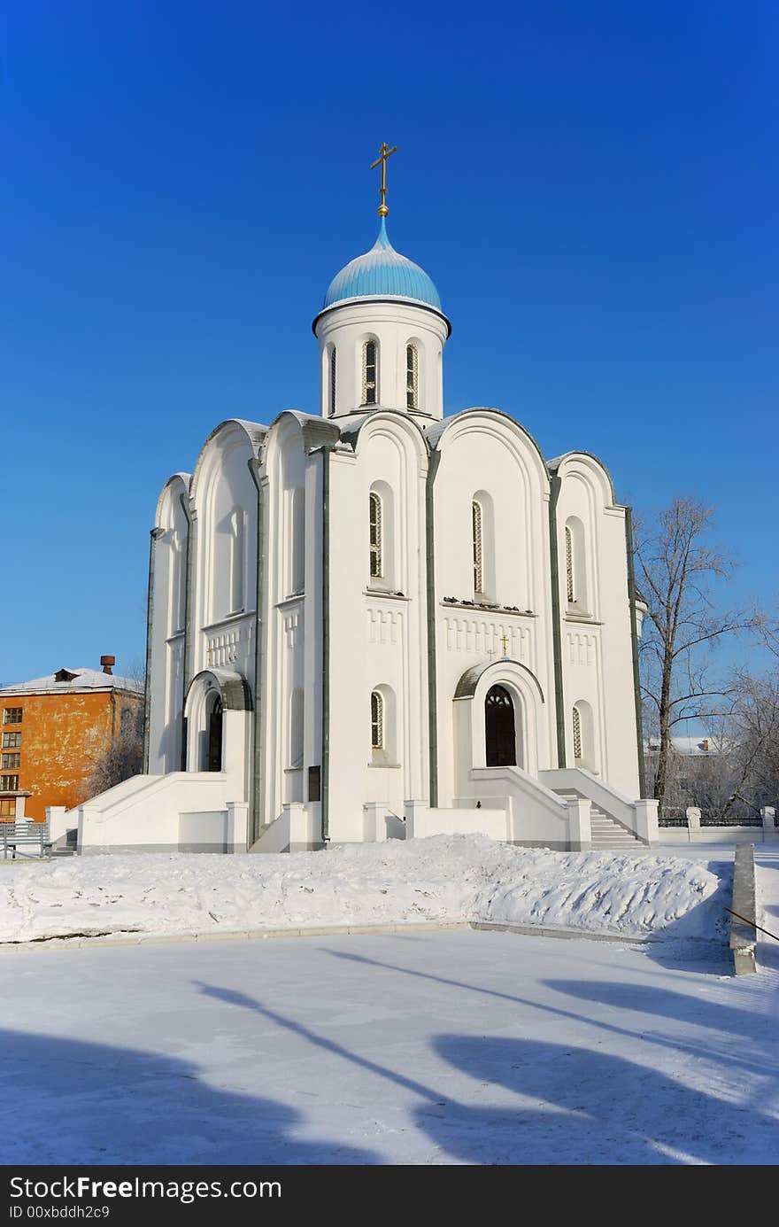 Small town Orthodox church in winter sunny day. Small town Orthodox church in winter sunny day