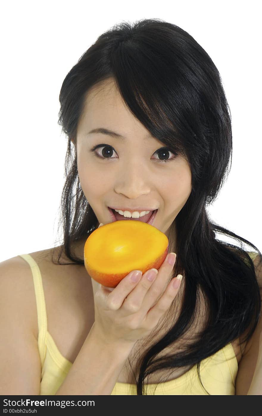 Pretty smiling woman with mango