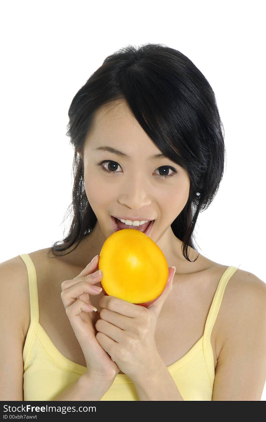 Pretty smiling woman with mango