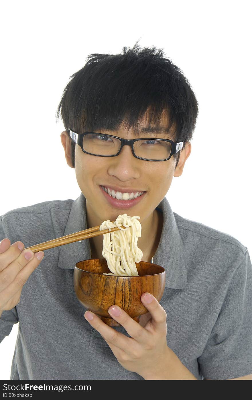 Young Asian boy eating food