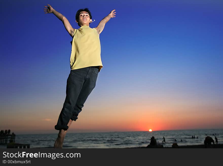 Exciting man in triopical sunset or sunrise. Exciting man in triopical sunset or sunrise