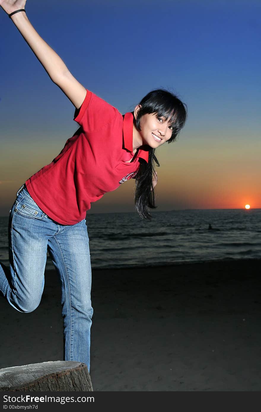 Photograph of asian girl in sunset