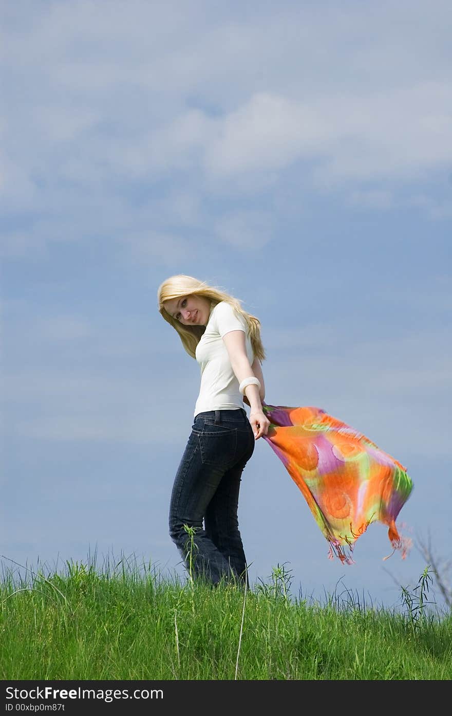 Girl with  scarf stand on a wind. Girl with  scarf stand on a wind