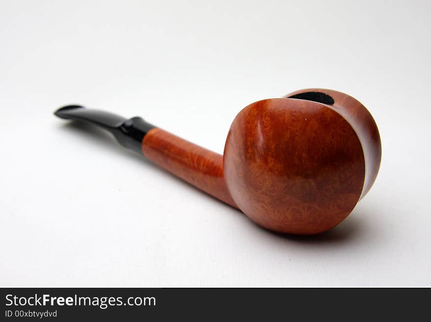 Only tobacco pipe isolated on white.