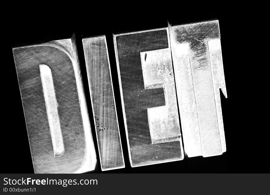 Negative image of the characters Diet in woodcut type. Negative image of the characters Diet in woodcut type.